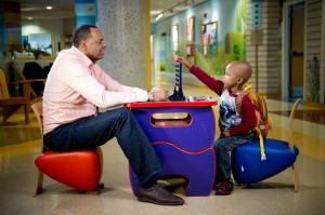 Lionel Hollins with St. Jude patient Ethan_ checkers