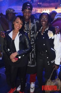 2 Chainz poses with his mother and the host of the Street Execs Charity Christmas Concert Monica.