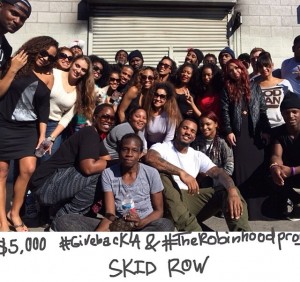 The Game's Robin Hood Project headed to Skid Row in his hometown of LA to spread 5,000 worth of holiday cheer. The group of volunteers which included The Game himself provided meals, water and gifts to kids leaving in tents on the street.
